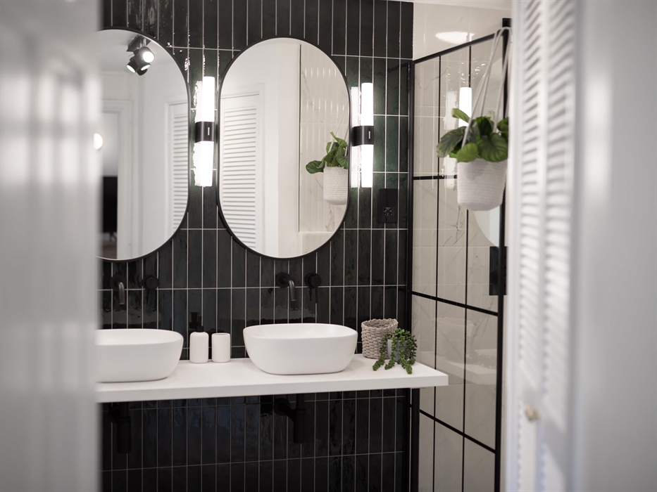 The dual sink vanity ensures ample space for both, adding a touch of elegance and ease to your morning routine amidst the serene surroundings.