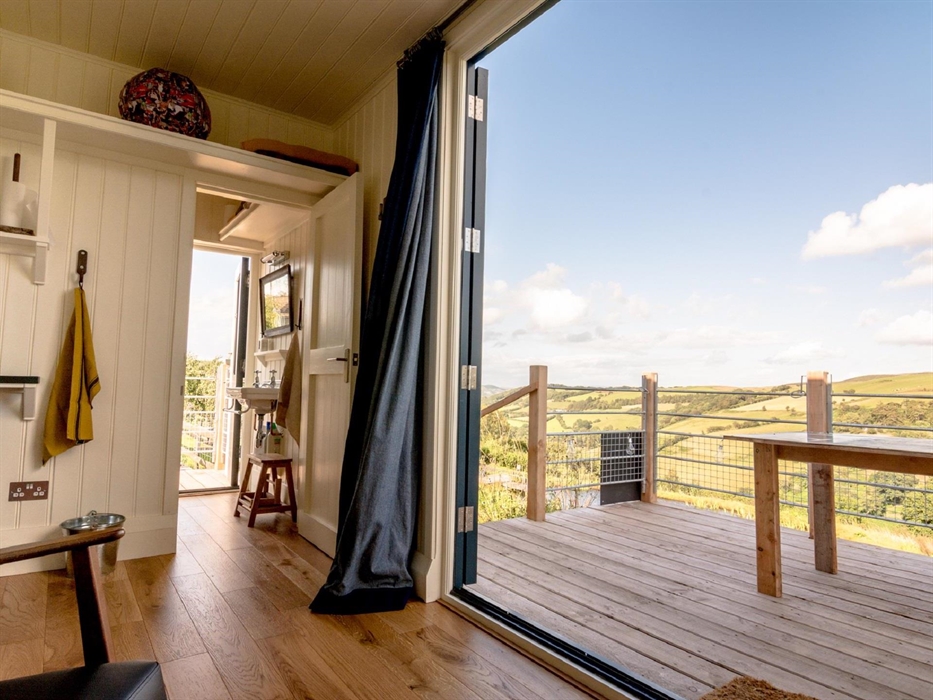 Enjoy far-reaching valley views from the Pantechnicon Powys alfresco dining deck.