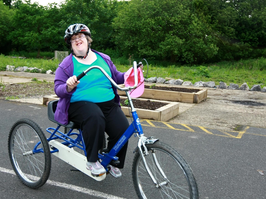 Woman on a trike enjoying cycling