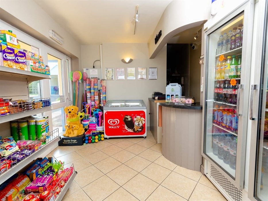 A small shop stocking essentials, gas, etc and a takeaway serving curries, pastas, and stone-baked pizzas, offering a wide range of dishes to suit mos