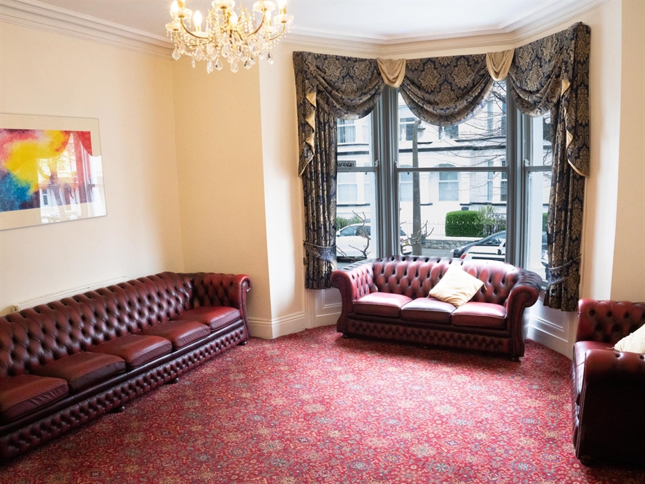 Beautiful guest lounge with 4 chesterfield leather sofas, one of which is 10ft long built especially for the space.  There is a large T.V., satellite