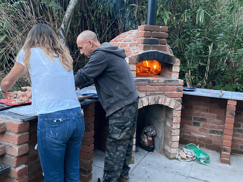 Pizza making fun in the wood burning pizza oven at Strawberry Skys Yurts