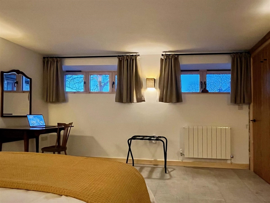 High level windows look out towards the sunset