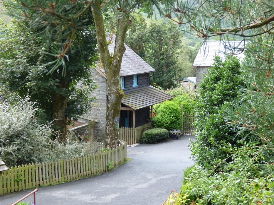 The Granary self catering cottage is surrounded by gardens and trees.