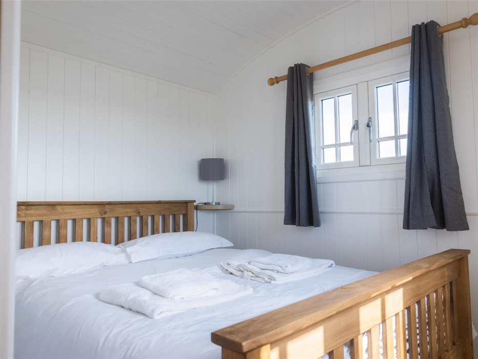 Double bed with crisp, white bed linen