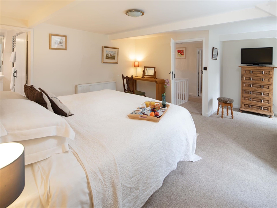The main bedroom has a super-king sized bed and benefits from an en-suite bathroom