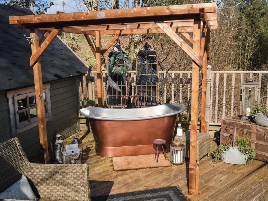 Our glorious copper bathtub provides a perfect perch by day to watch the Brecon Mountain Railway chug by, or at night, sink below the bubbles and gaze
