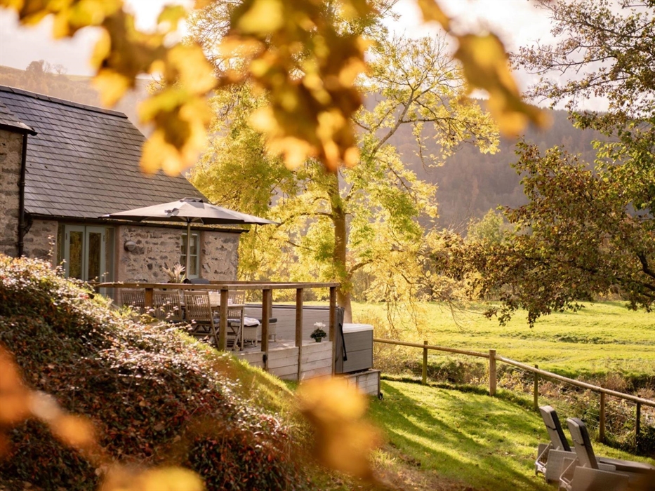 An autumn day looking out over the garden of Flyfishers Cottage