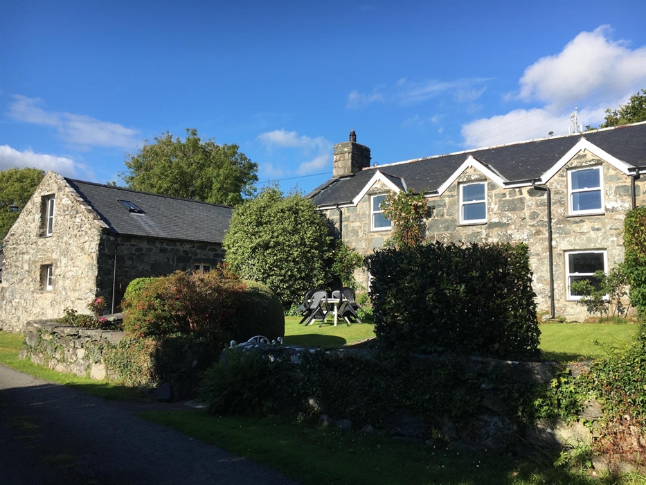 Stone traditional welsh farmhouse and adjacent cottage in converted farm building