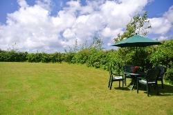 Lawned area and courtyard for guests.