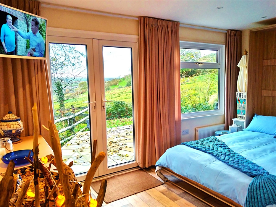Can you see that view? Look across the Patio and the fields sweep down to the sea at Tywyn