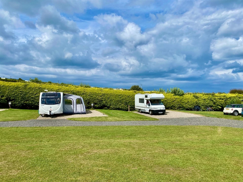 Stunning all-weather serviced pitches suitable for tents, touring caravans and motorhomes