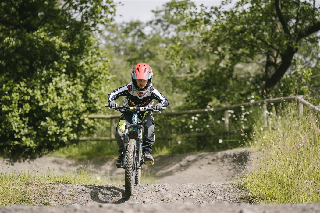 Small kid riding the pump track
