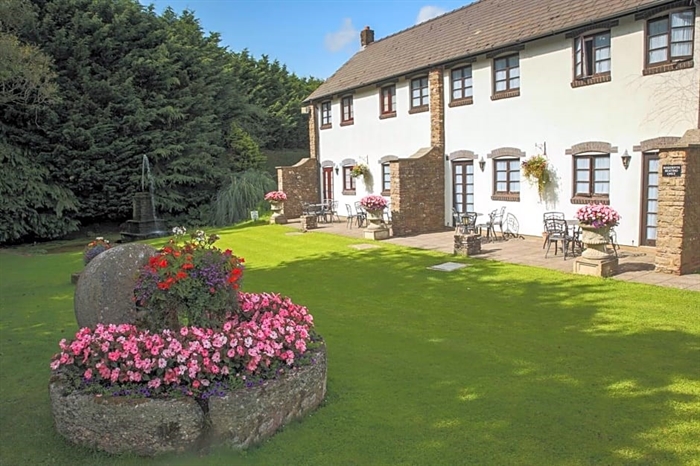 Beautiful lawned garden with water fountain