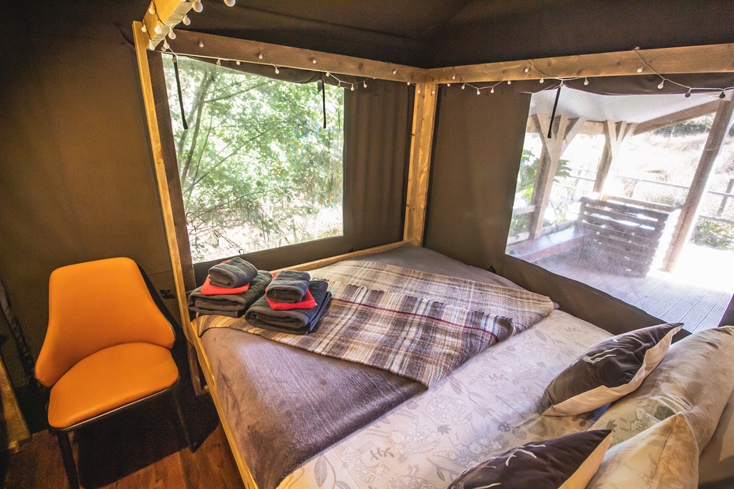 Comfortable four poster bed in a private bedroom