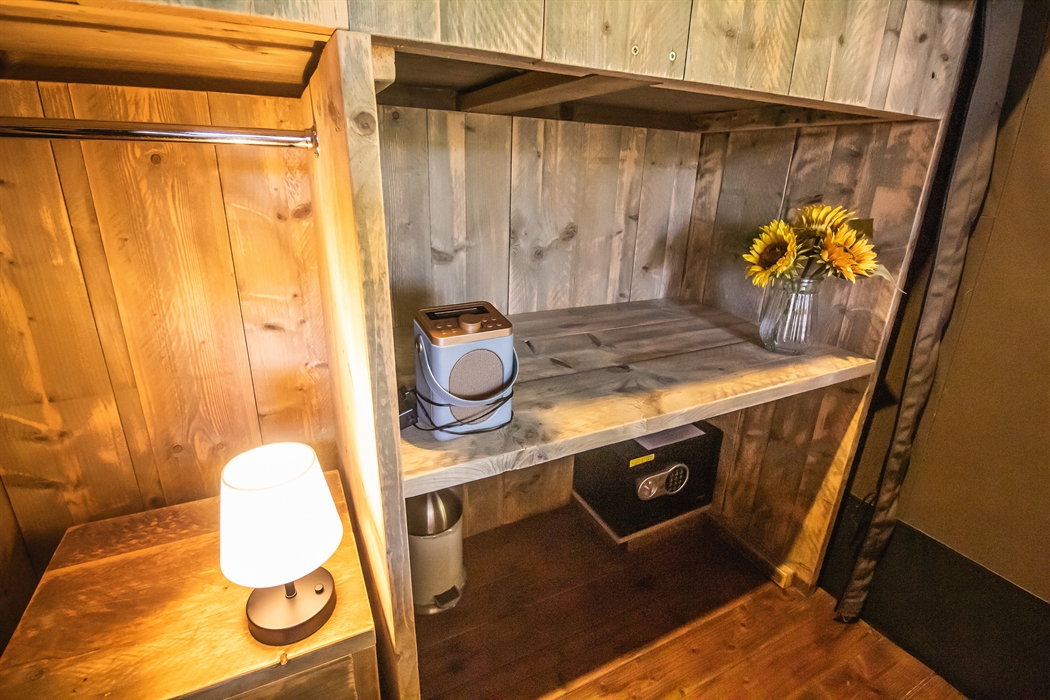 Wardrobe space with a safe and a DAB radio speaker