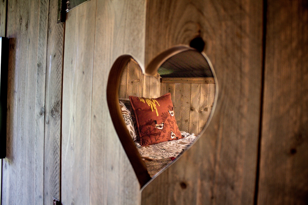 A double bed in a cosy cabin