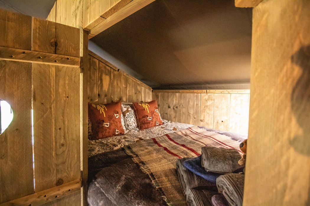 Cosy double bed cabin with blankets and hot water bottles.