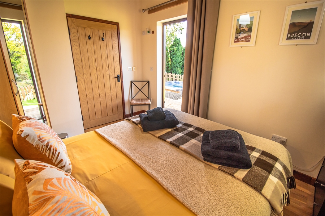 Ash and Sycamore Lodge double bedroom with access out to veranda