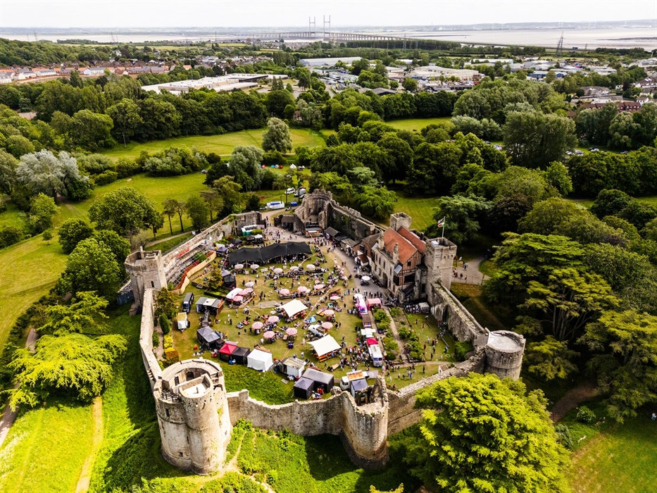 Caldicot Castle from the air with the Big Banquet food stalls and tents circling the communal dining areas within the castle walls