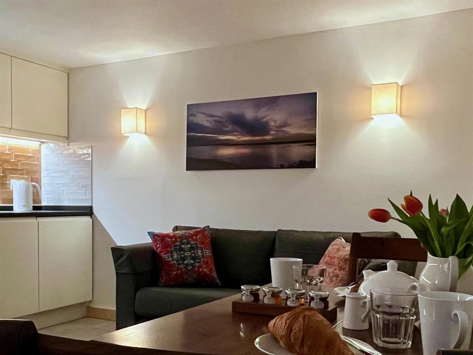 The cosy lounge includes a dining area