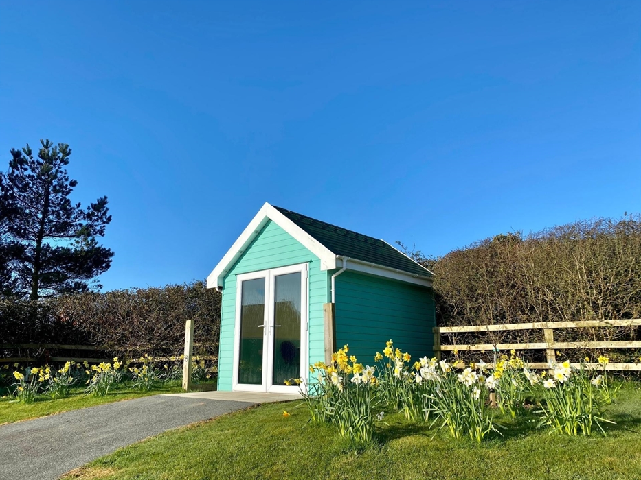 Beach Hut Dining Pods where guests can enjoy beverages and their take-aways