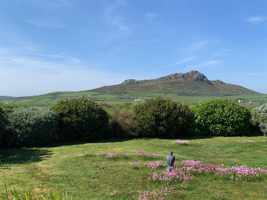 Guests can relax and enjoy, one of the two gardens, this one does have a lovely mountain and sea view.