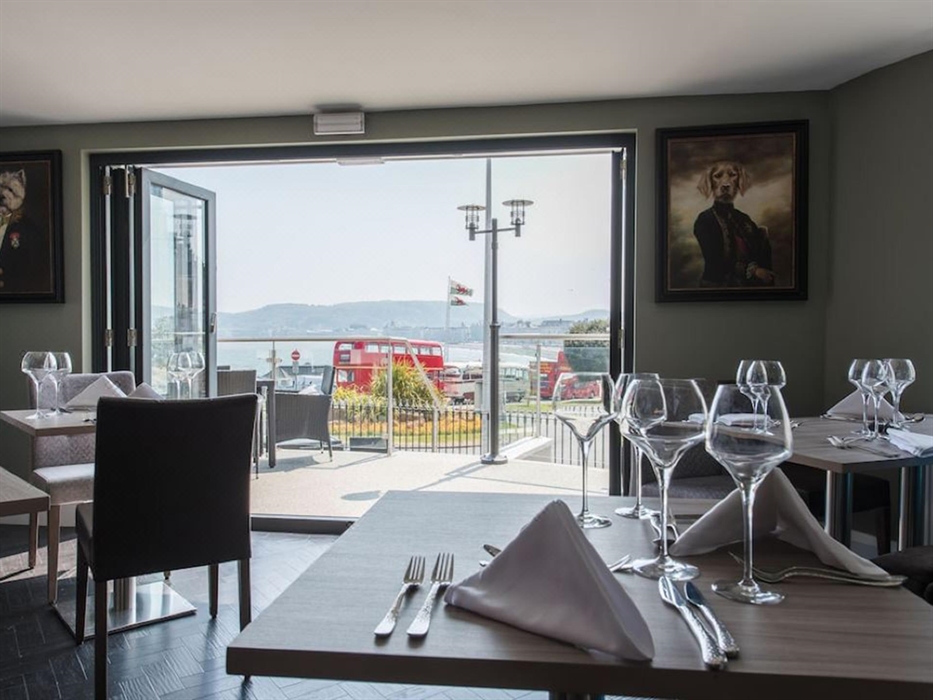 Enjoy elegant meals with stunning sea and mountain views. Open the doors to fresh coastal air and a relaxed, refined setting.