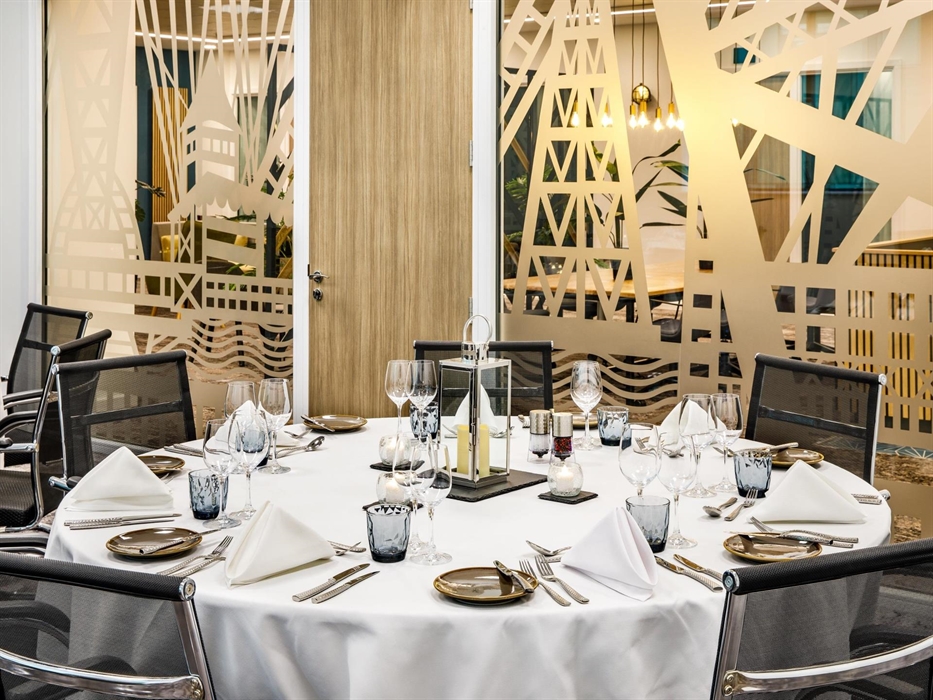 Meeting room with tables set for dinner