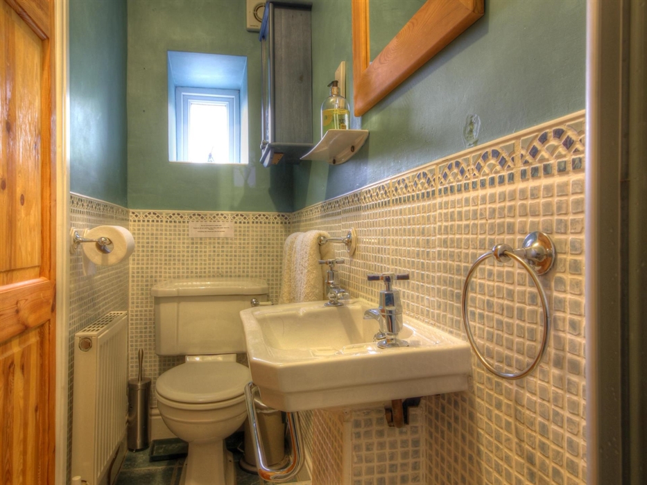 En-suite shower room. White fittings