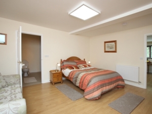 This bedroom is very spacious and has a sofa settee which can be made into a bed.