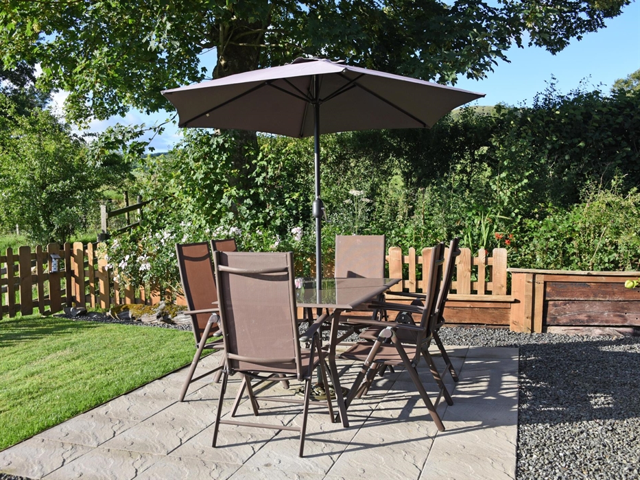 Relax on your private patio overlooking the fields and the countryside views.