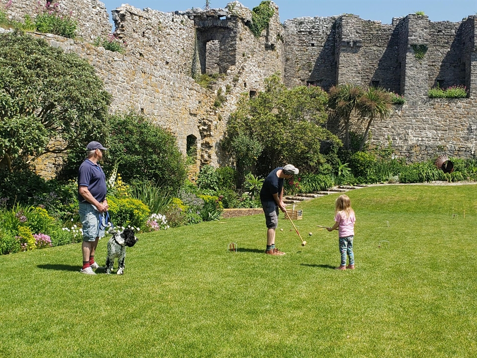 Visitors enjoying a game of croquet on the lawn