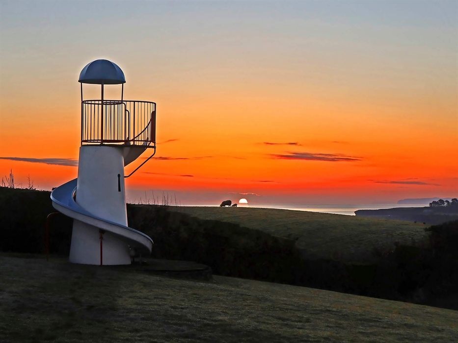 A large children's play area including slides, swings and climbing frames
