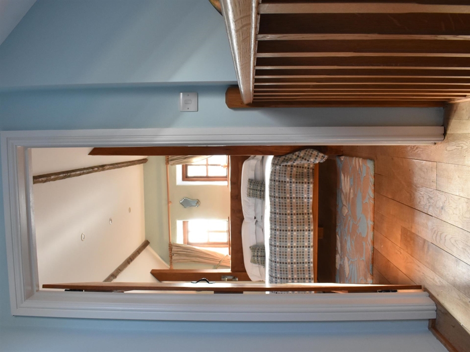 Coach House suite is a spacious, relaxing retreat. Its floor-to-ceiling windows draw in the light and colours of the countryside, and a downstairs liv