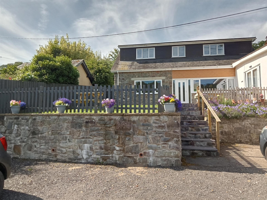 Front of house with large drive plenty of room for 4 cars