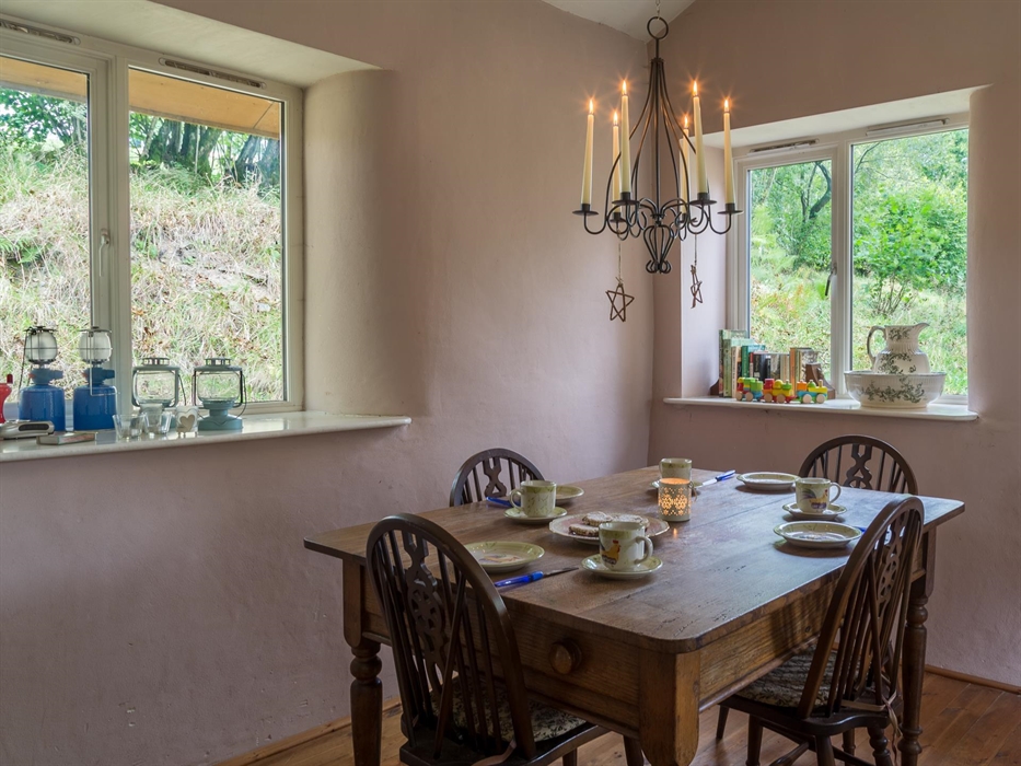 Dining table with candelabra. Booster seat for babies and toddlers.