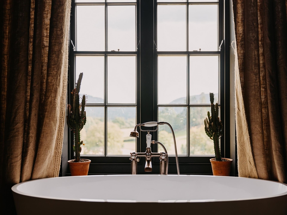 Perhaps the most magical of all, this warm room also has an ensuite with a golden tadelakt bath, surrounded by botanical plants.