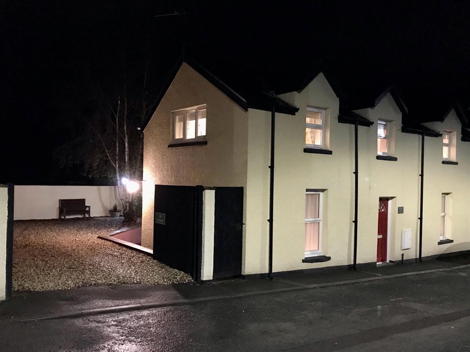 Well lit with security lights at night.