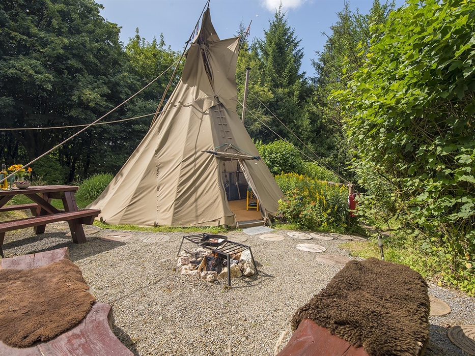 An authentically decorated Tipi - an original glamping experience. The Tipi is heated with a woodburning stove (with a fireguard). This accommodation