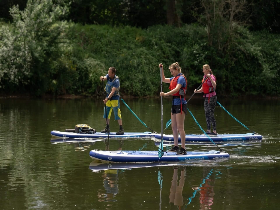 Stand-up paddle boarding on the River Wye best things to do in the Wye Valley at Monmouth Wales and near the Forest of Dean.
