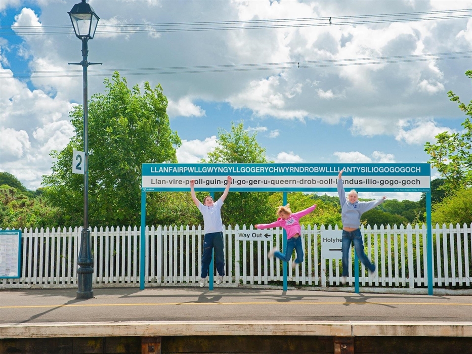 Young people jumping at Llanfair pg
