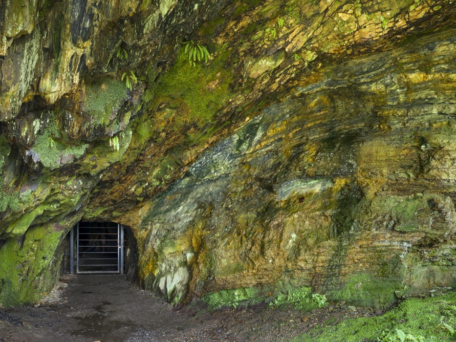 Mine entrance set in rock portal