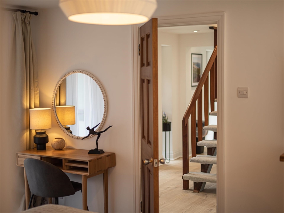 Cherish the rustic charm intertwined with modern elegance in a bedroom designed for peaceful retreat.