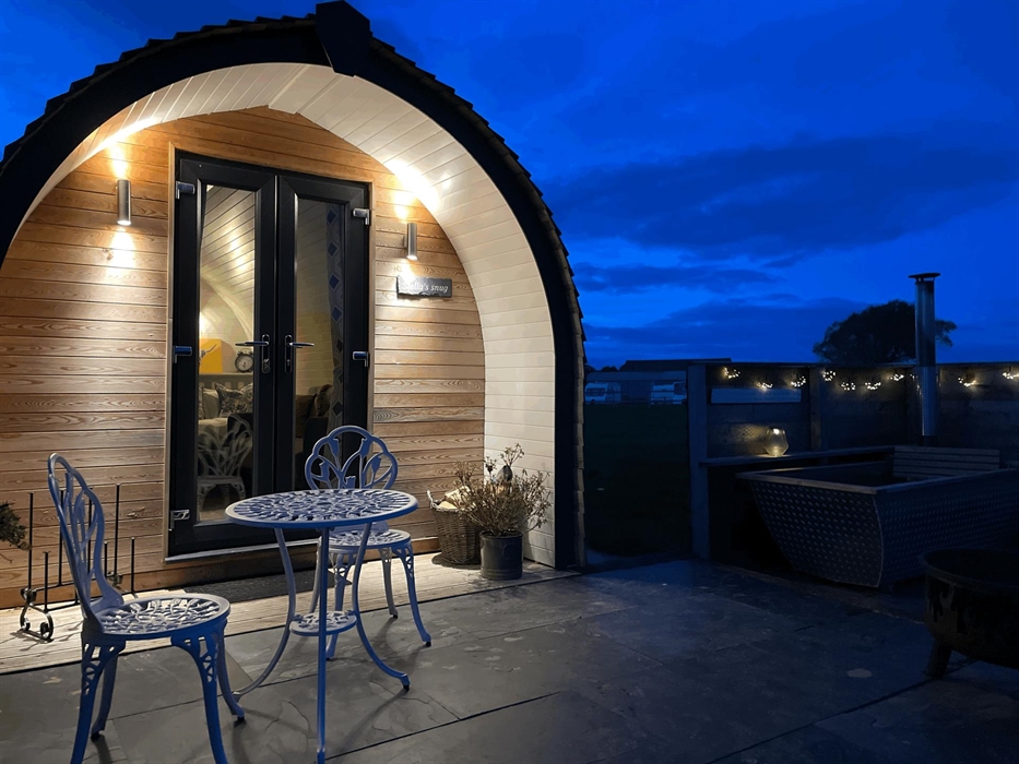 Glamping pod at night showing dark skies and mood lighting
