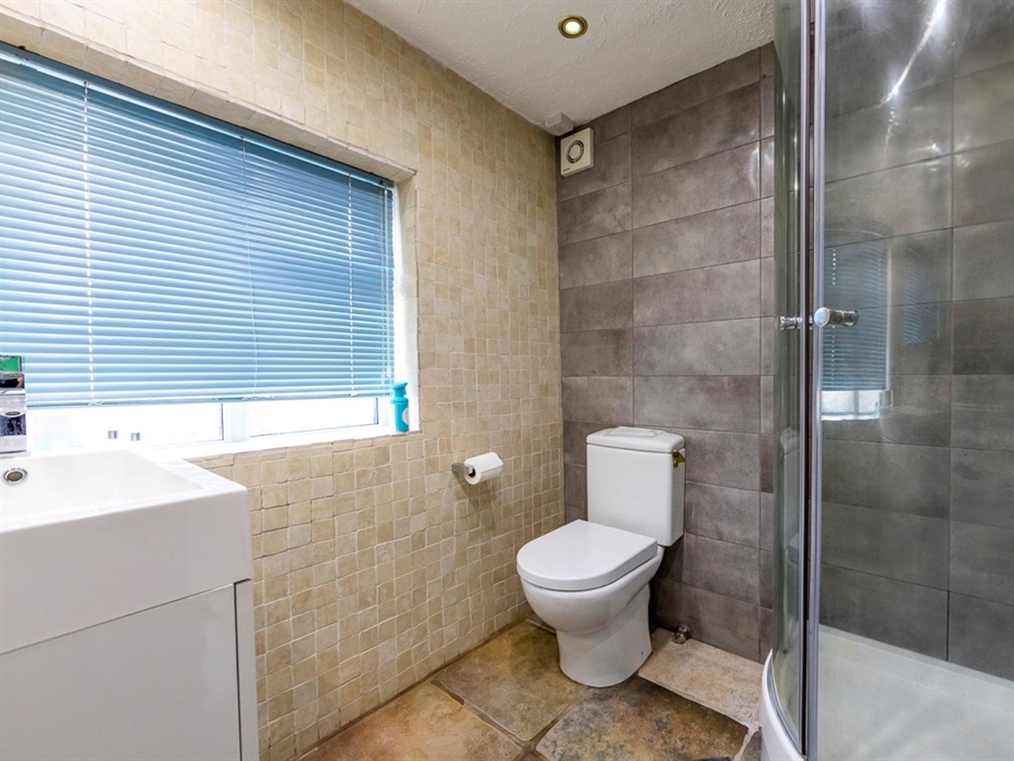 Foxes Reach Wye Valley fully tiled downstairs shower room. Upstairs there is also a smart bathroom with bathtub and shower over,, WC and washbasin, sh