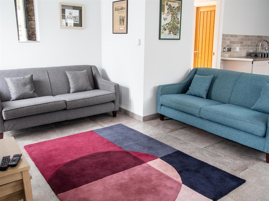 Lounge that opens out onto a riverside patio.