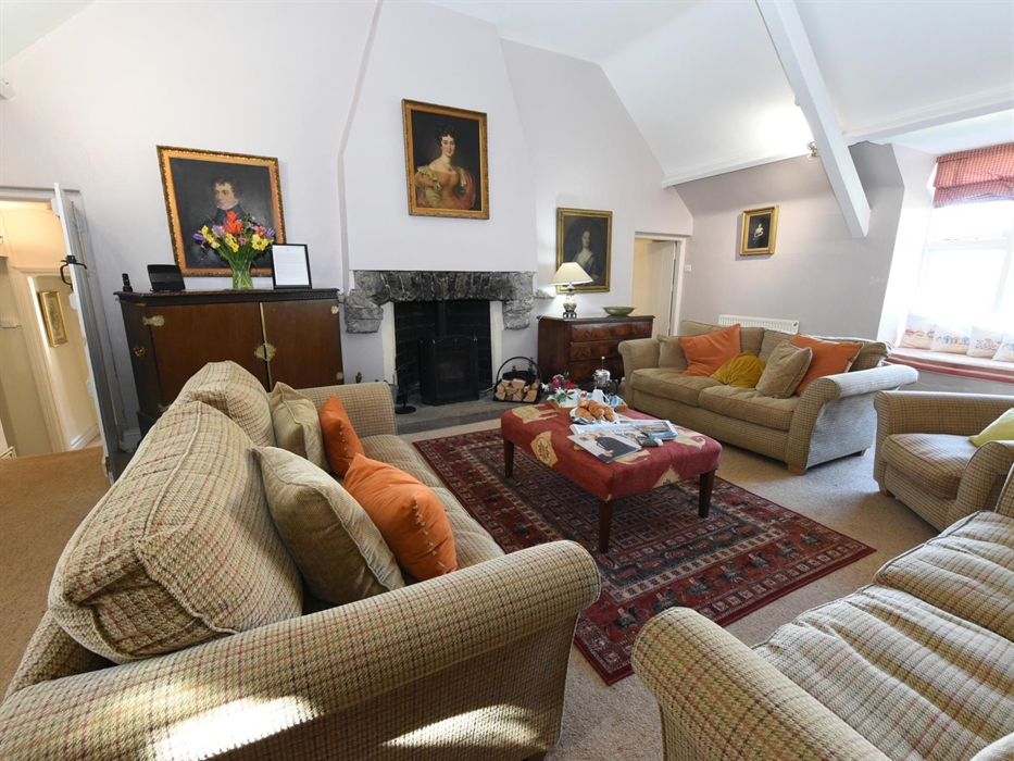 Plenty of room to sit around the fire in the cosy lounge