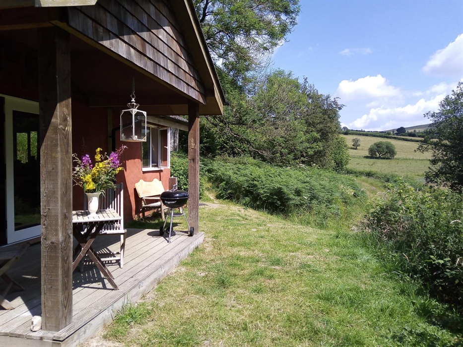 view from the veranda looking out over fields and hills.