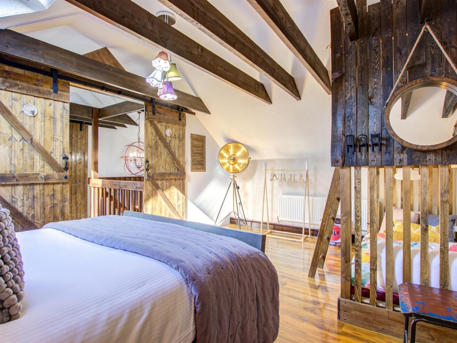 Large family room with double bed and bunk bed